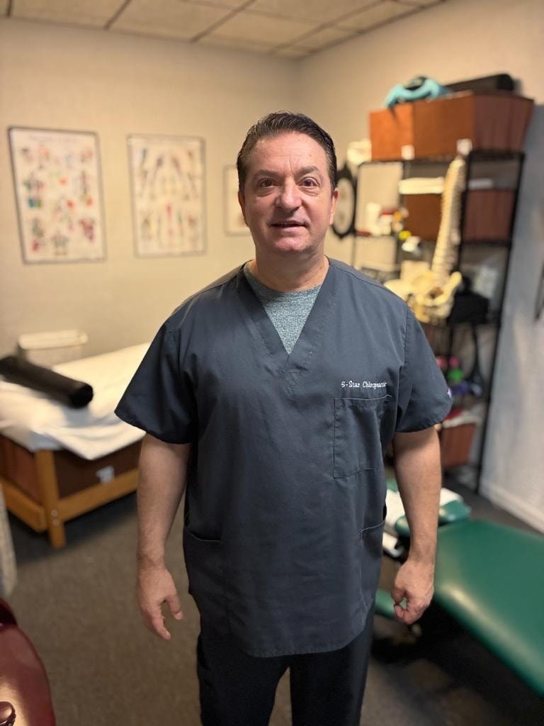 Dr. Fiore in the chiropractic treatment room at 5-Star Chiropractic